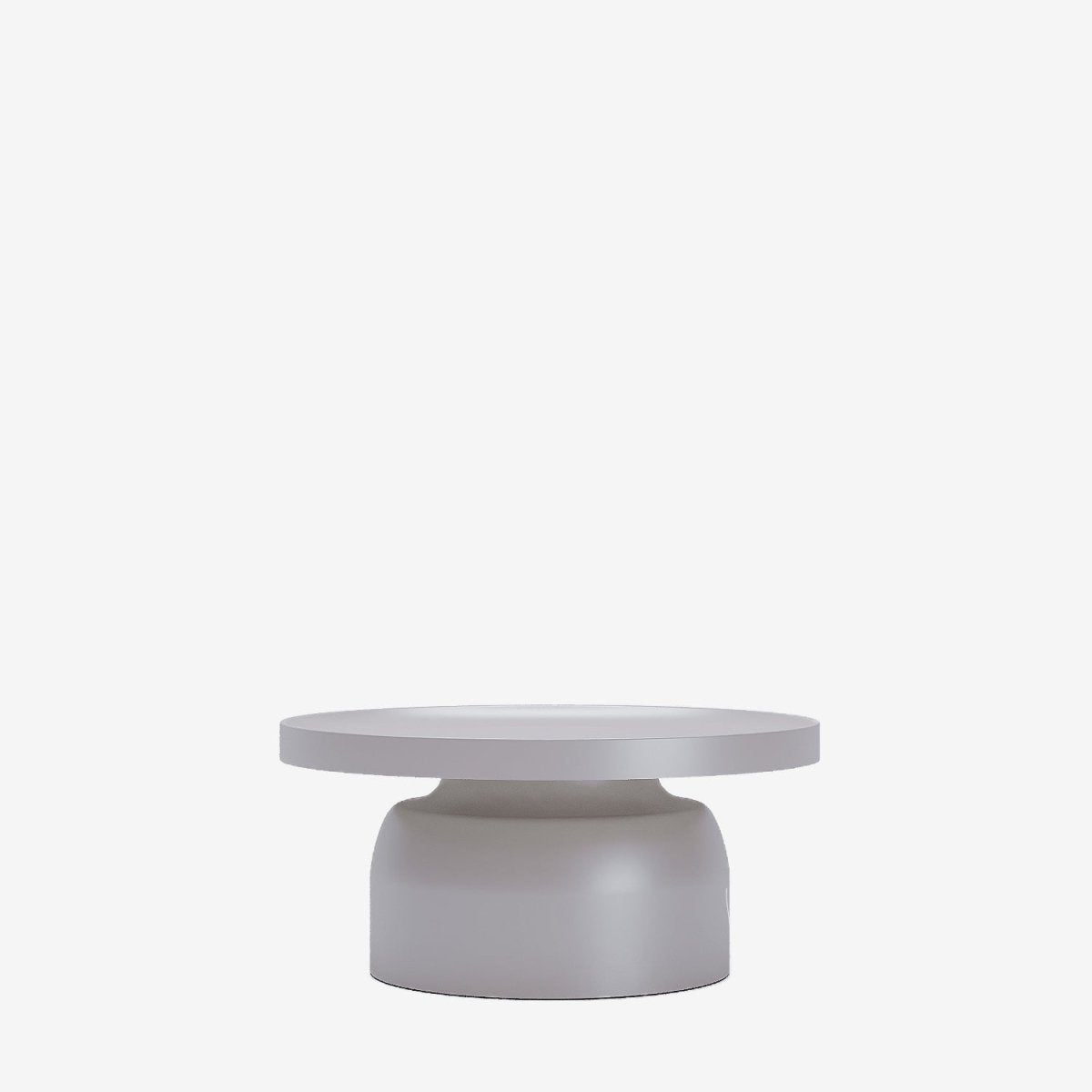 Une table basse ronde en métal gris clair signée Potiron Paris peut donner un style moderne épuré ou un style tendre, bohème, vintage chic
