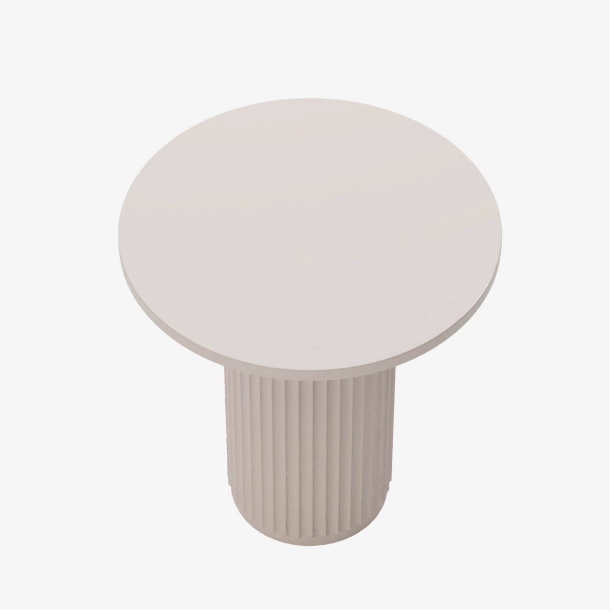 Une élégance minimaliste séduisante pour cette table d’appoint ronde cannelée rose et signée Potiron Paris