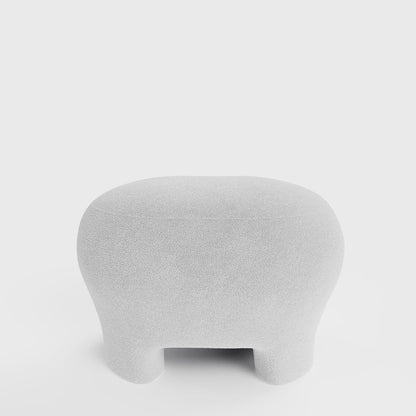 Ninon – Pouf repose-pieds tapissé en bouclette blanche Potiron Paris